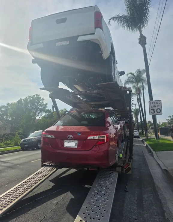 Open carrier delivering vehicles on an interstate route through Colorado