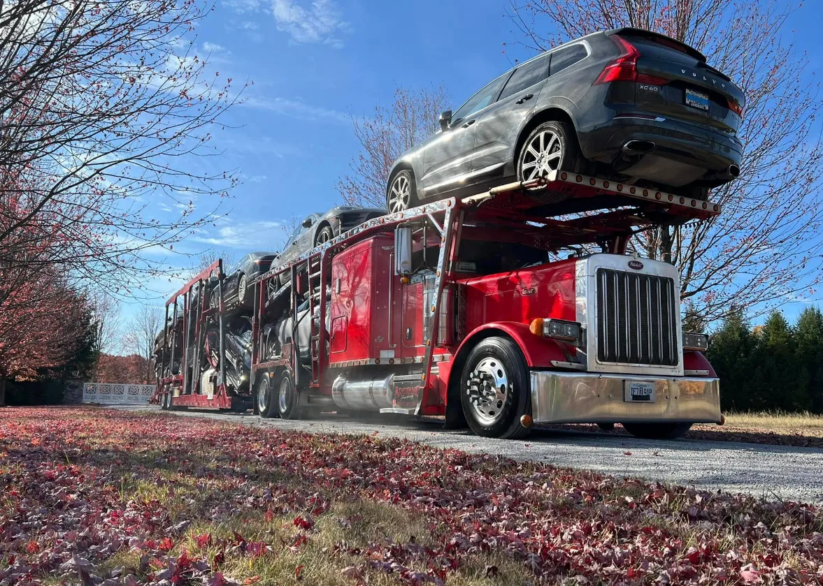 Open auto transport truck shipping cars along the Front Range